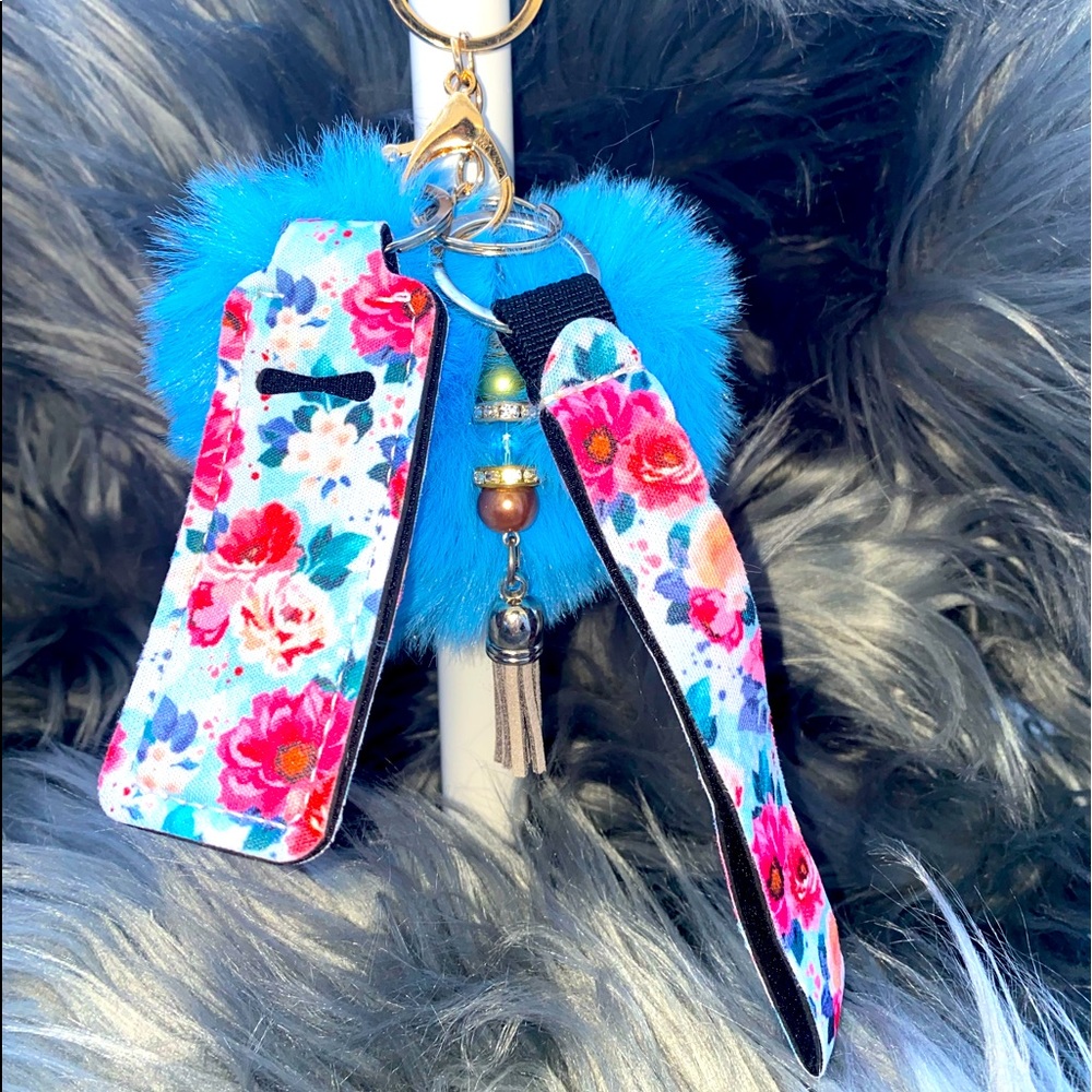 Floral wristlet with chapstick holder and blue fur heart